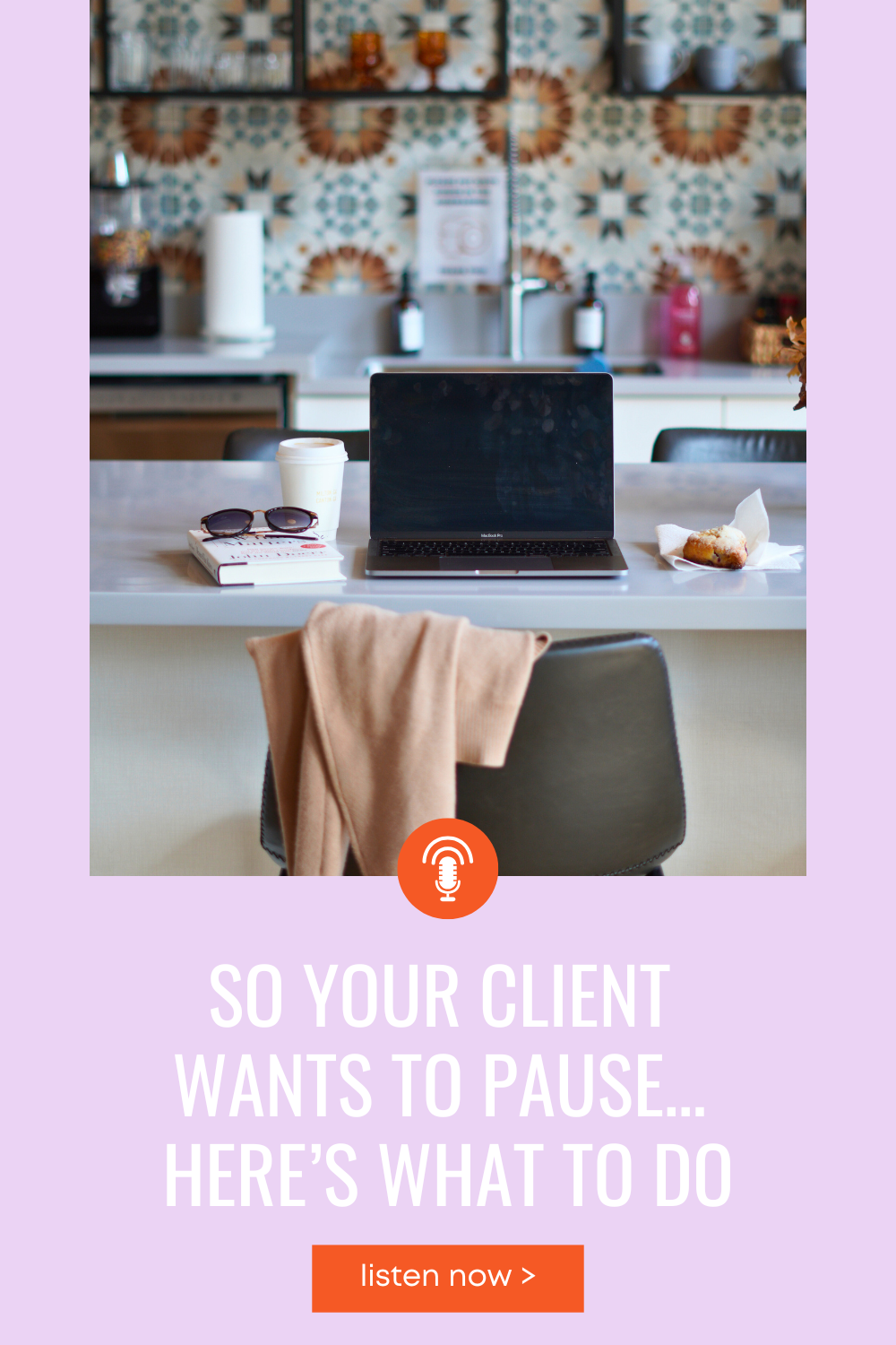 Laptop on kitchen island with jacket, coffee, and pastry
