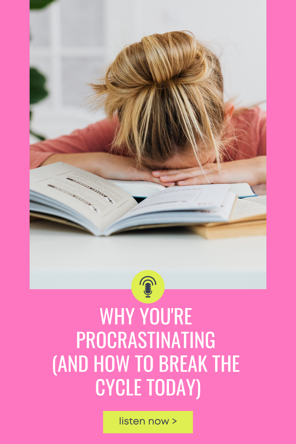 woman with head on book on desk, overwhelmed
