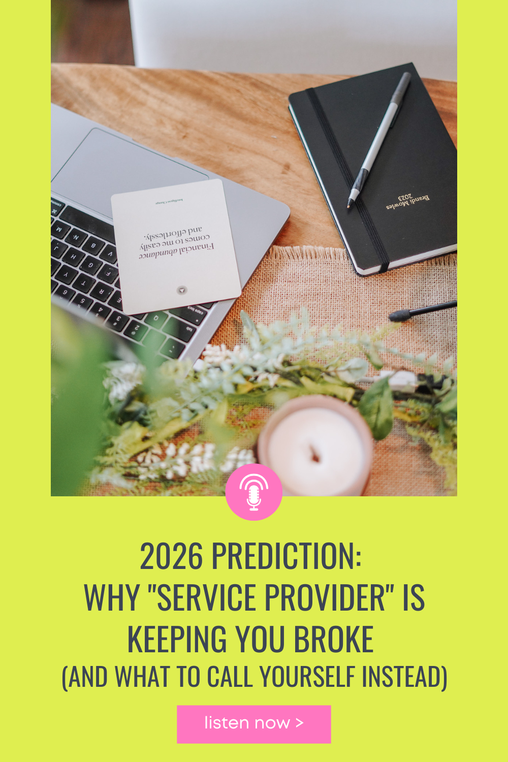 Desk with laptop, notes, candle, and affirmation